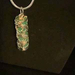 Jade and silver pendant with 16” silver snake chain.